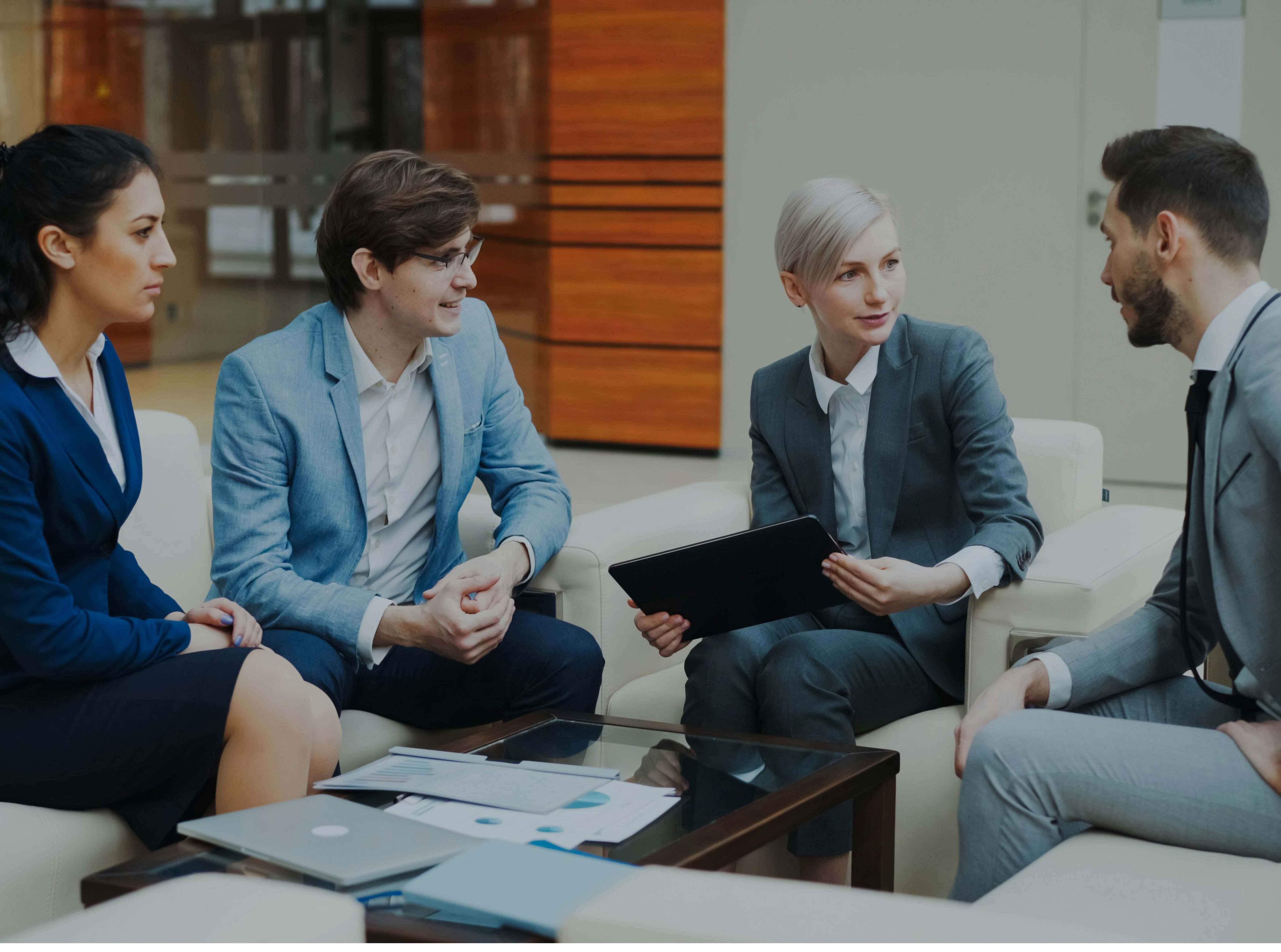 Business professionals sitting in a meeting.