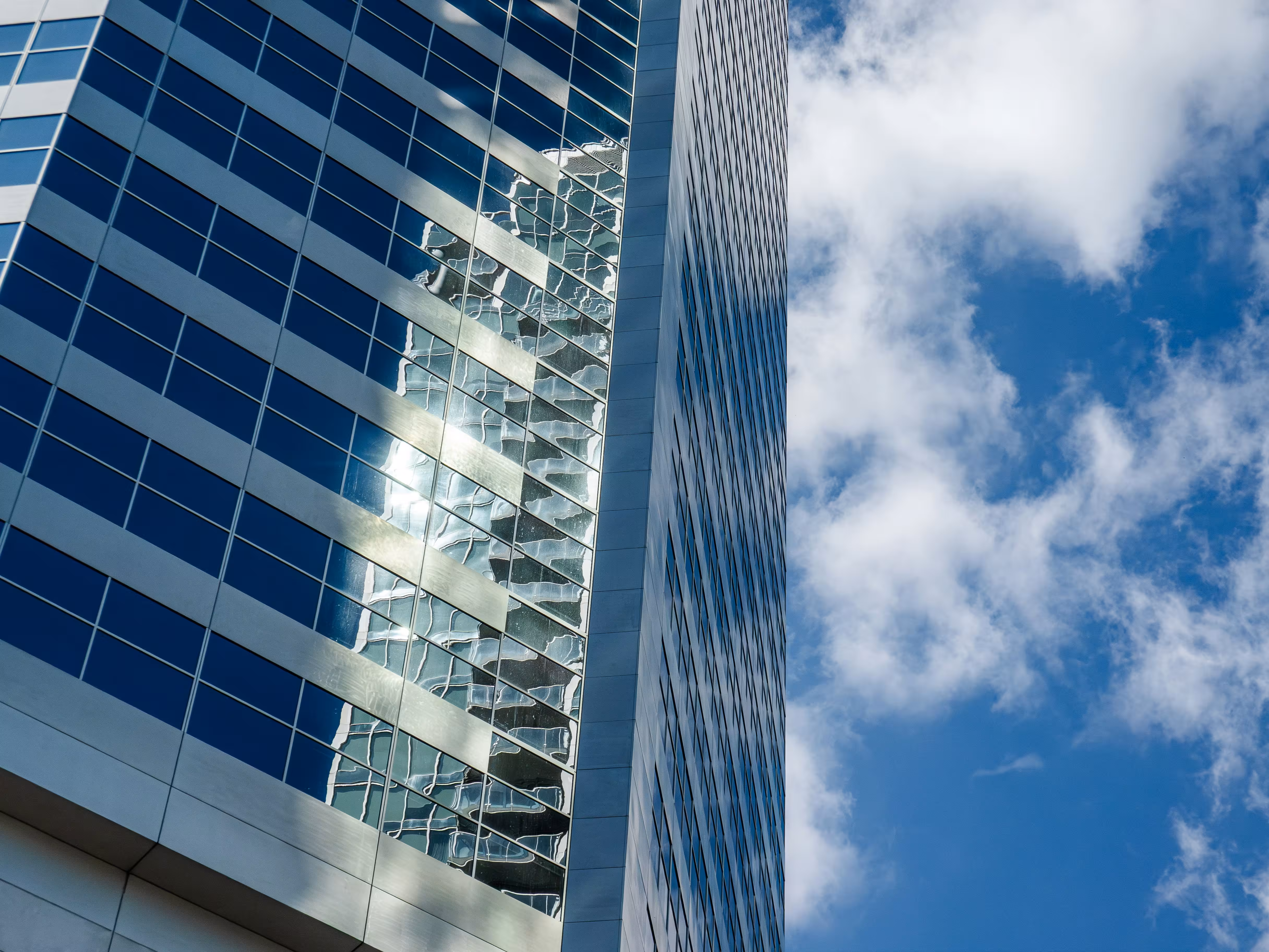 Keiko Akamine standing and posing in front of black background