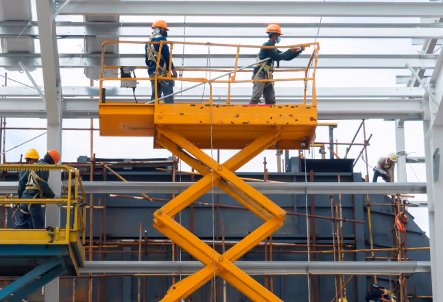 A photo of a lift used by construction workers with an Xtellio Pro Xentral in front