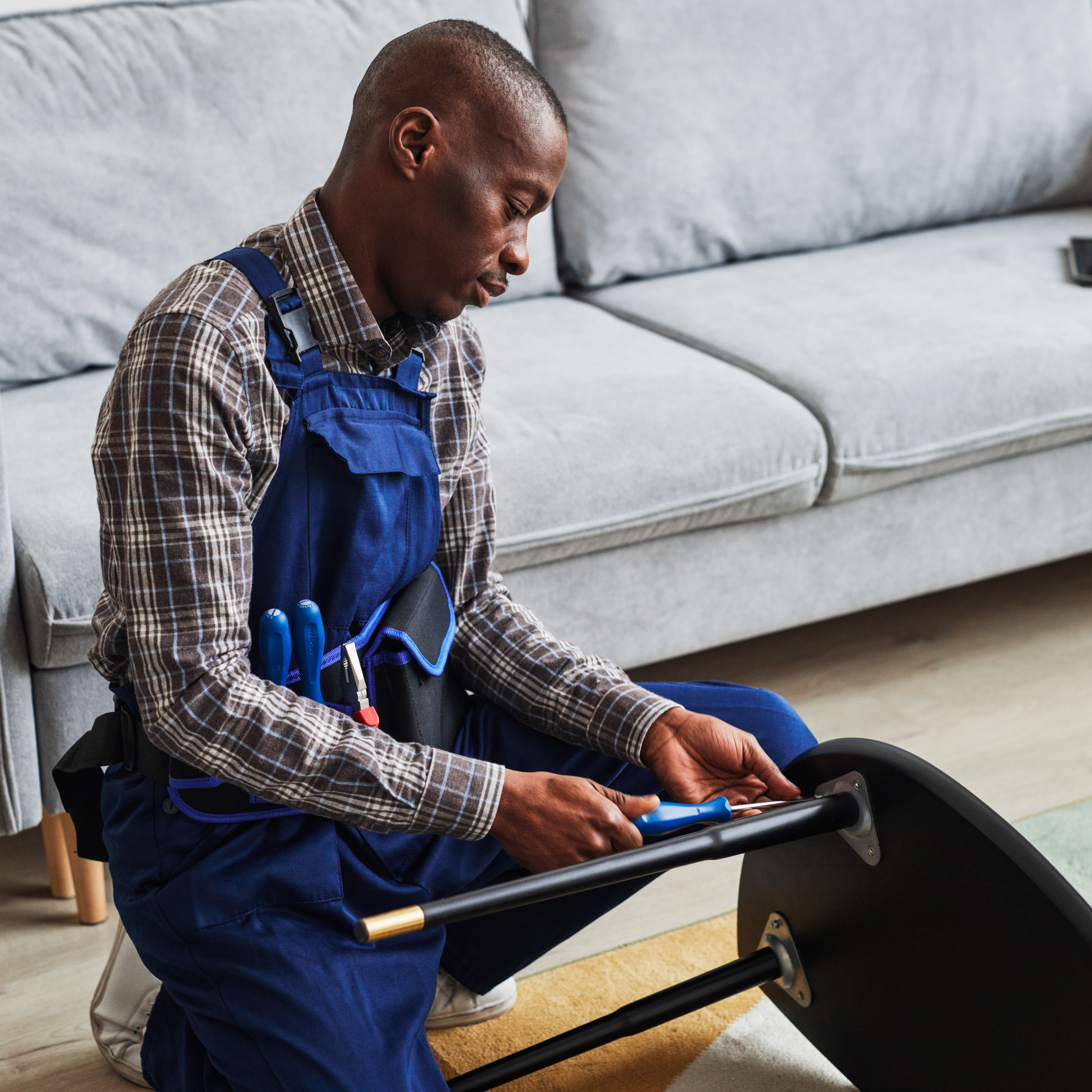 A man fixing a chair