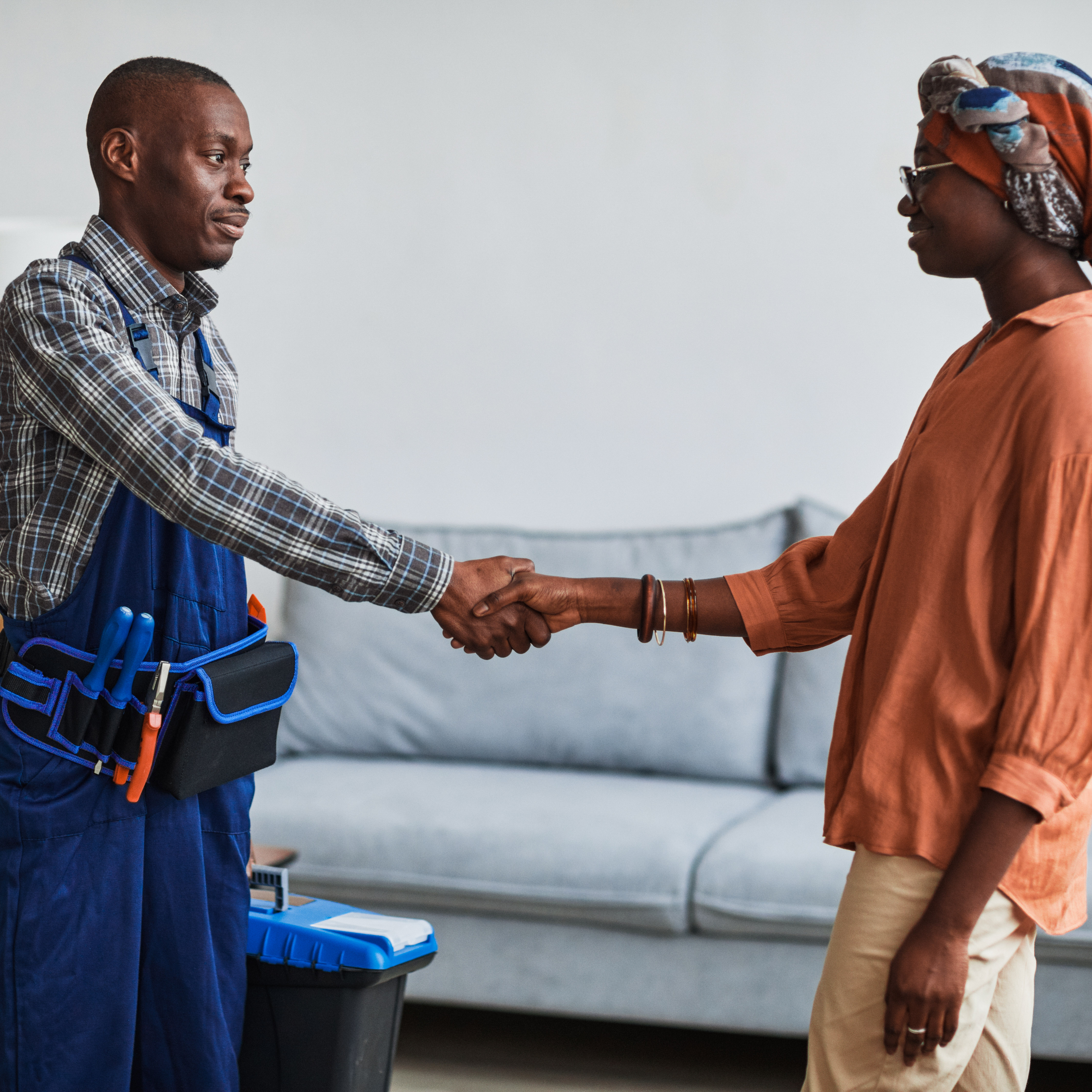 An artisan exchanging handshake with a female client