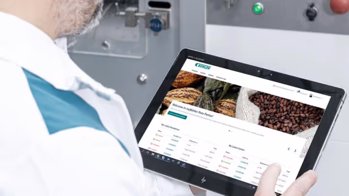 Buehler employee holding a tablet