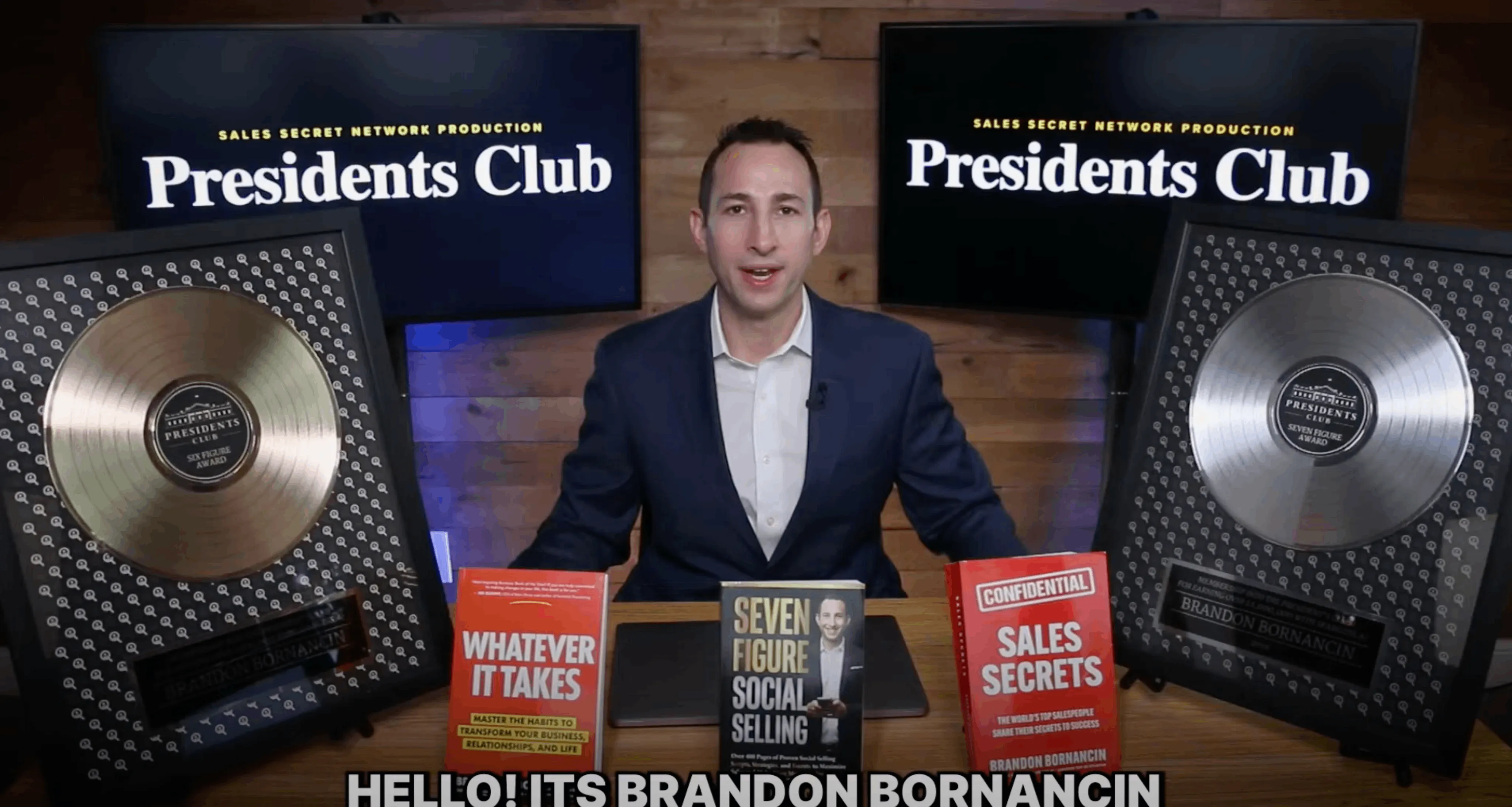 Brandon Bornancin presenting his books and President's Club award