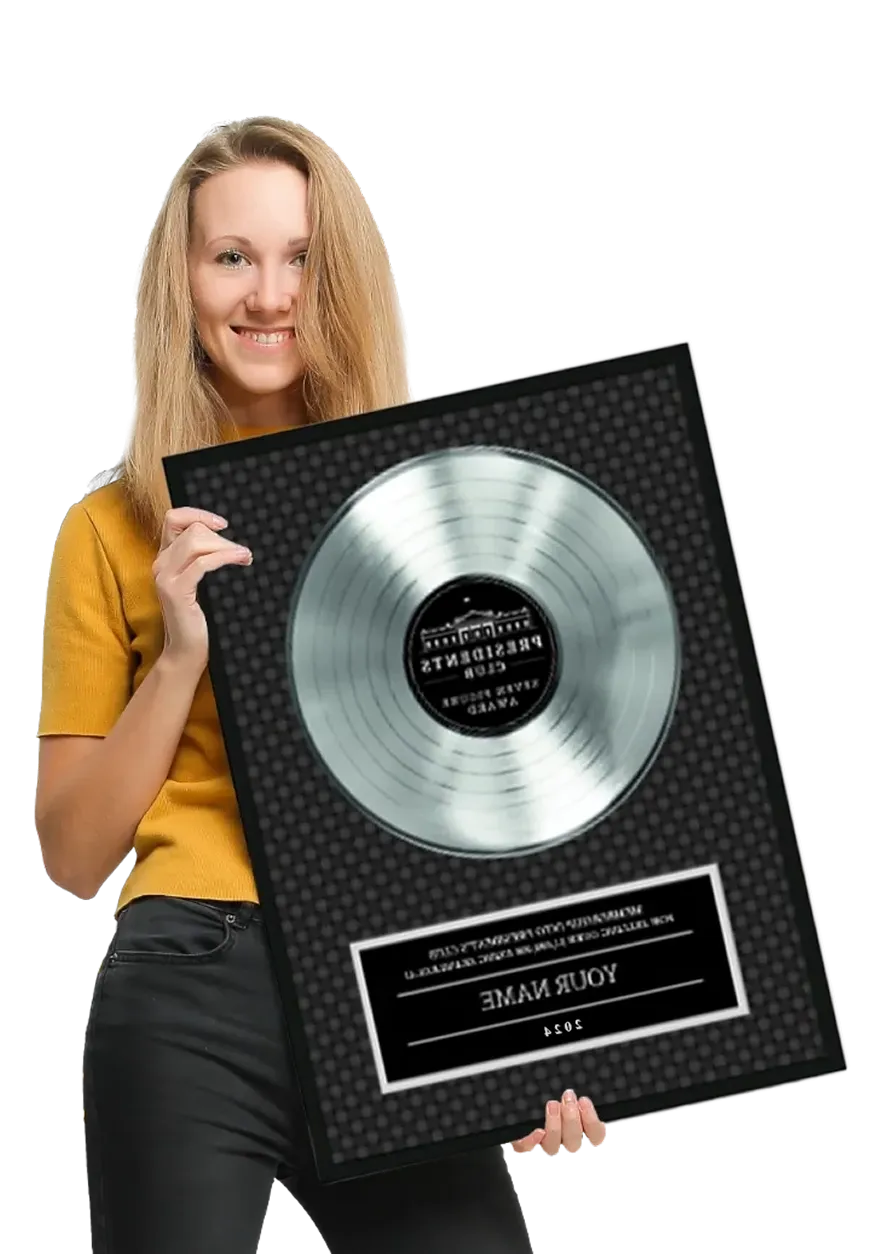 woman holding 7-figure President's Club award