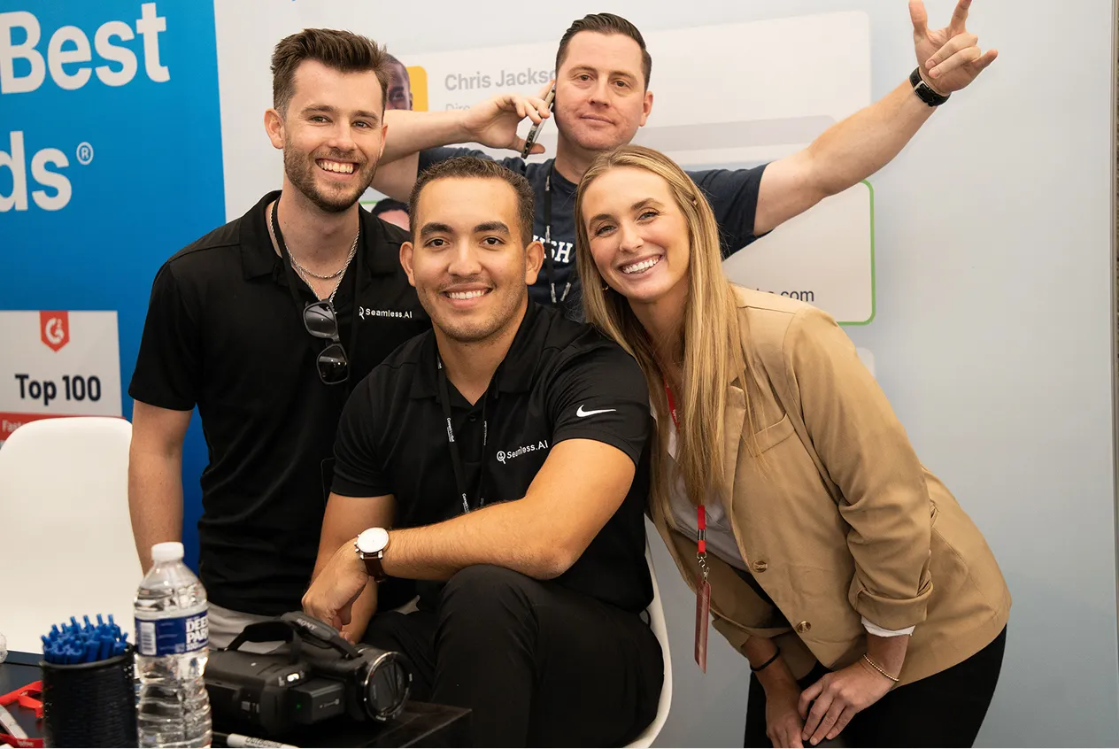 Small group photo of Seamless employees at an event.