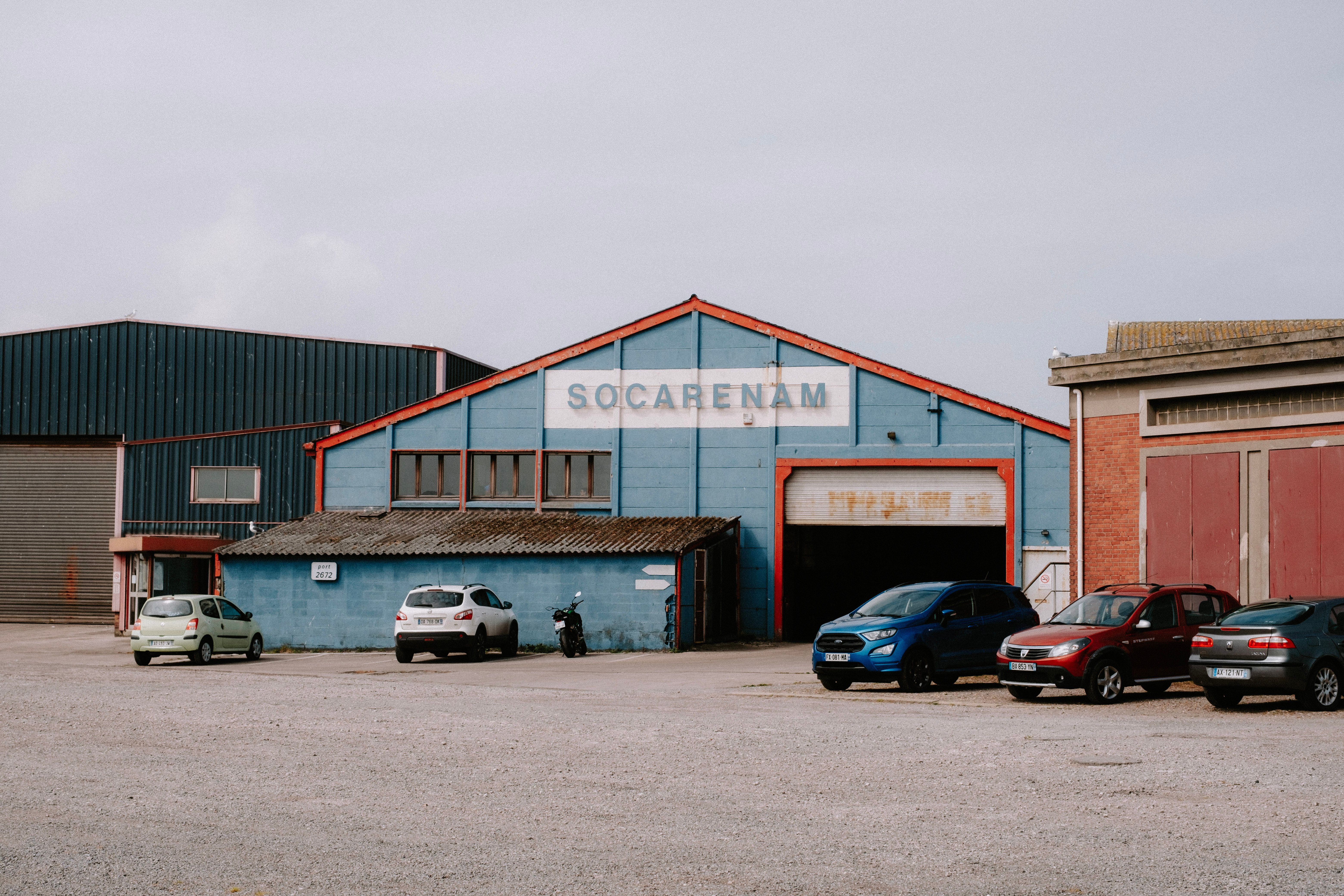 Warehouse exterior with parked cars