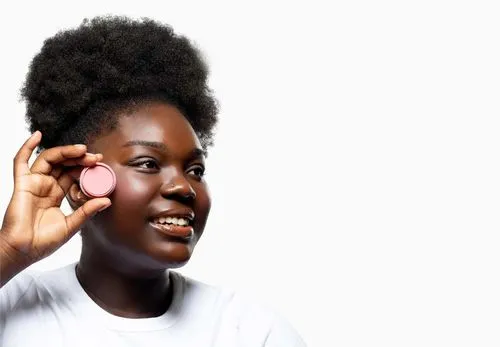Full-body model: smiling woman holding a pink compact near her cheek on white background
