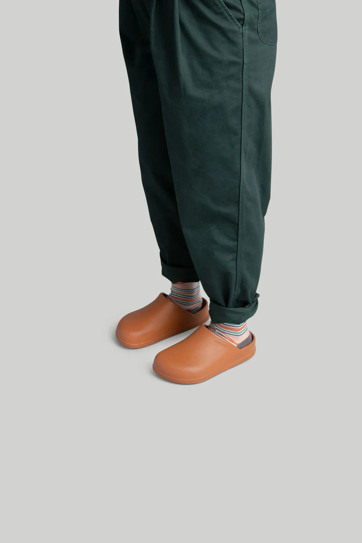 a full body model on a red background