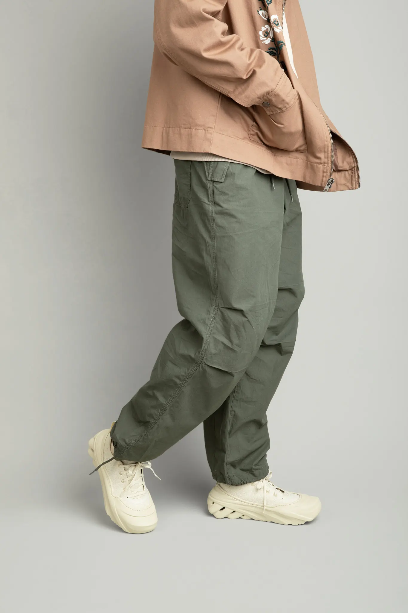 A stylish male wearing croc sneakers