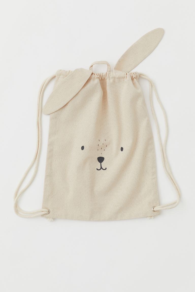 Drawstring bag with animal ears and face design