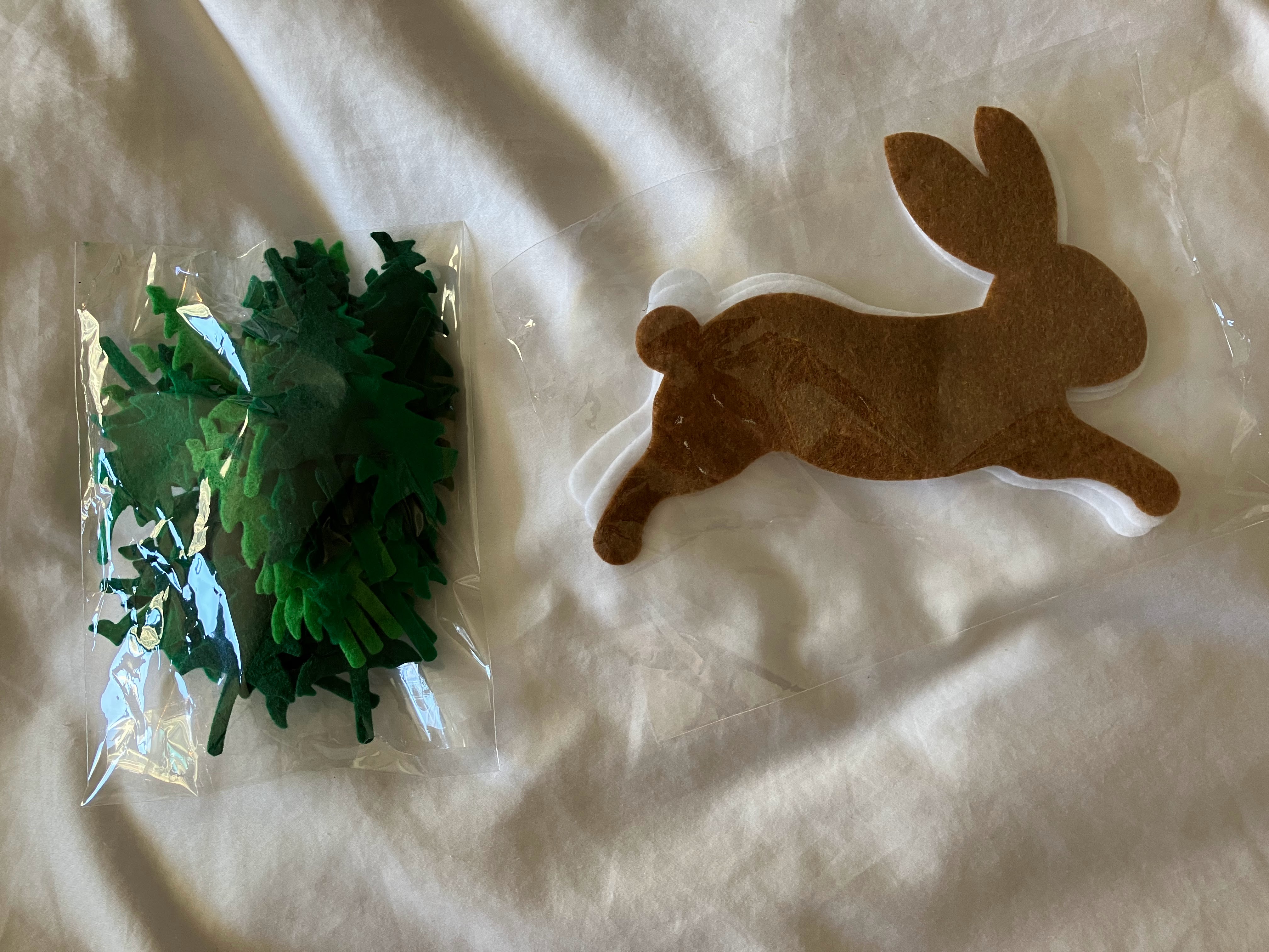 Brown felt rabbit and green leaves for customizing acoustic panels in hard of hearing child's room