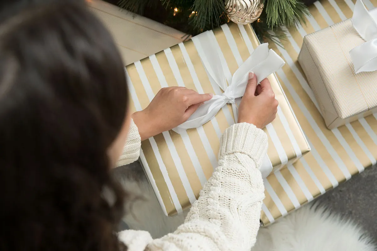a woman opening a gift