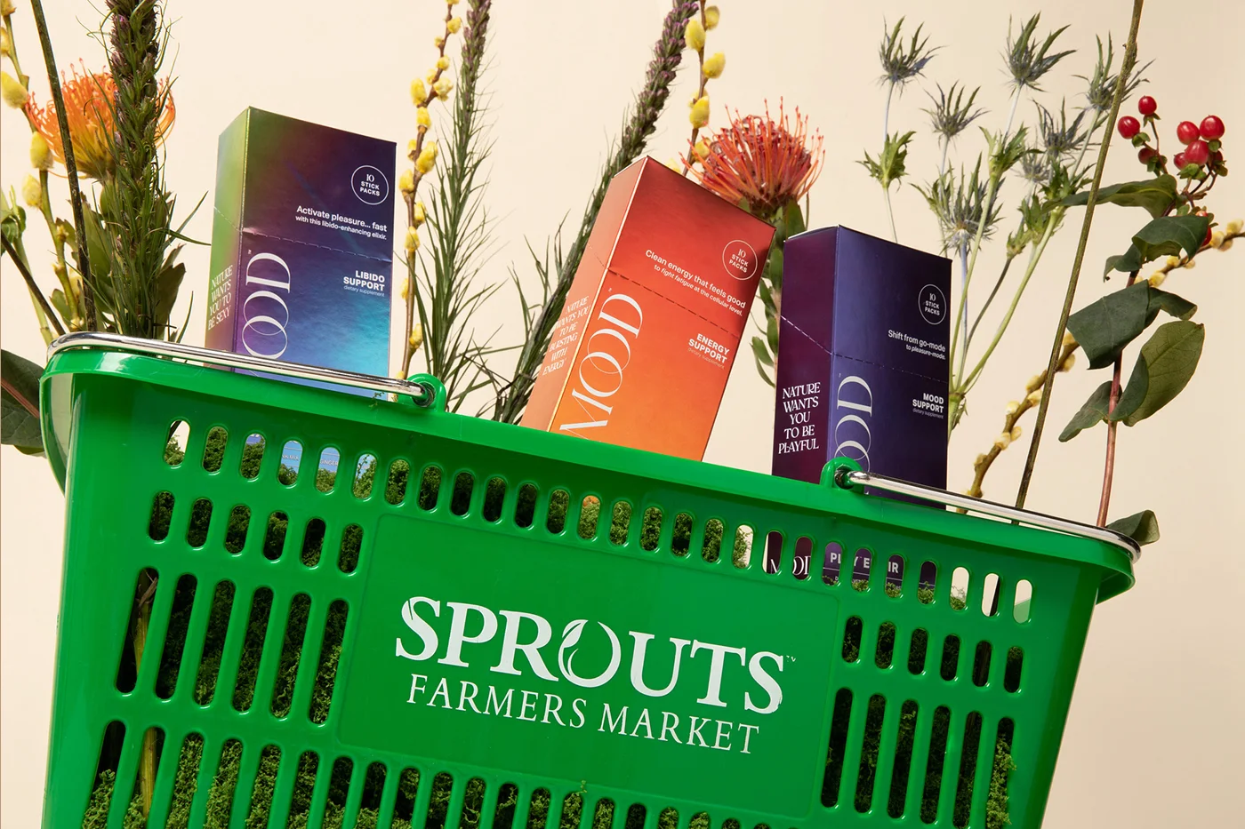 Mood products in a Sprouts basket with flowers