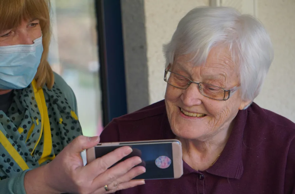 old woman looking at a smart phone