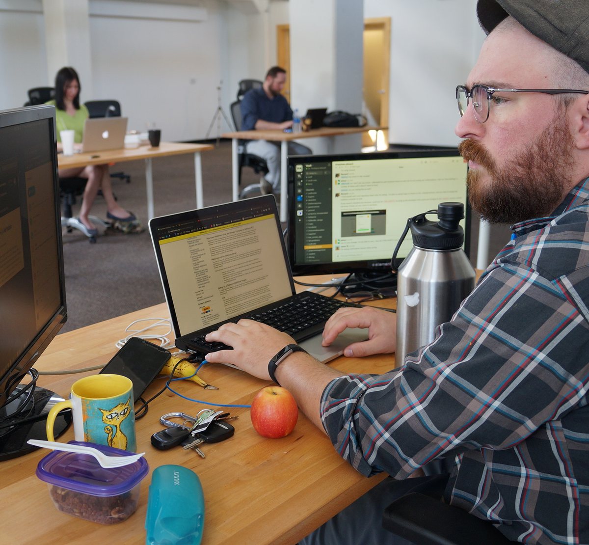 A VAULT developer testing an app across two monitors