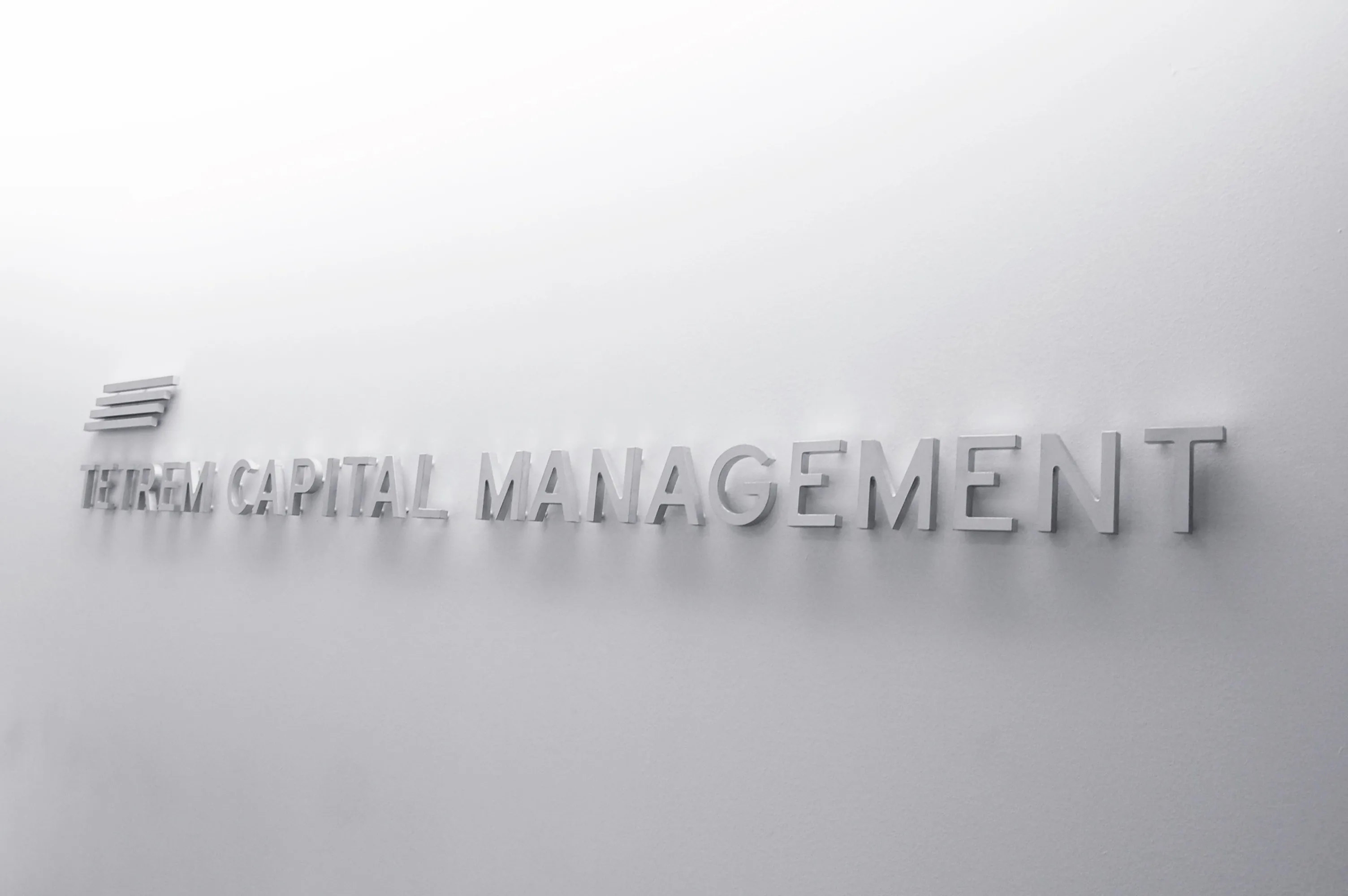 Tetrem Capital Management logo on wall signage by Edmond Huot