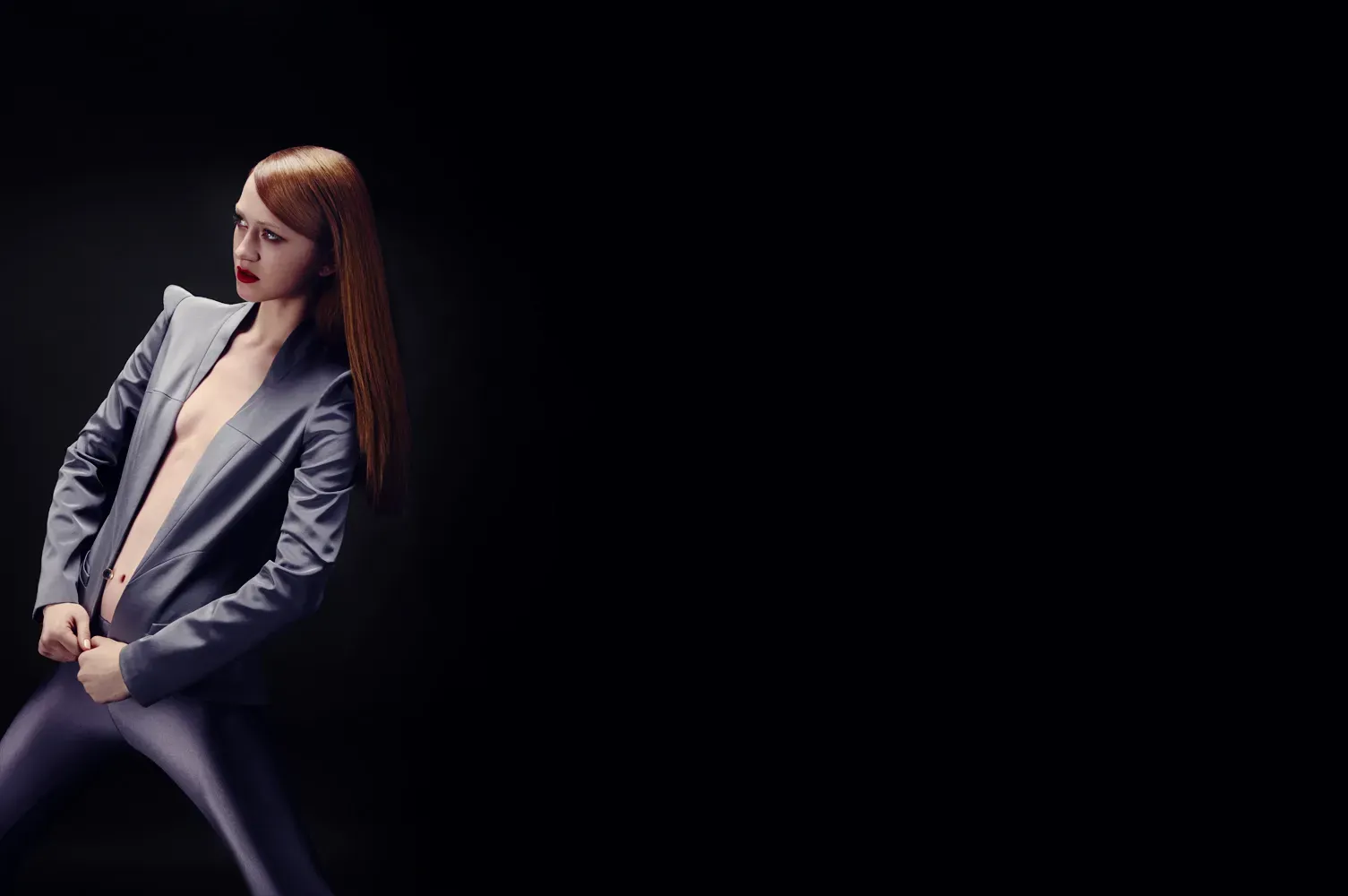 Timothy George Woman posing with a grey blazer photoshoot by Edmond Huot