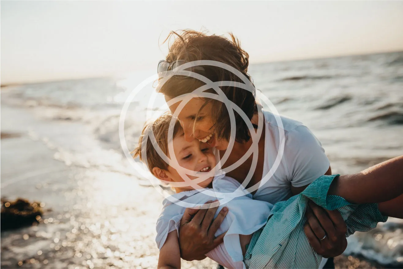 Woman holding a child with Momentum icon overtop by Edmond Huot