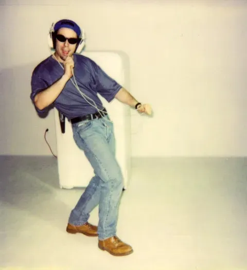 Dancing next to a fridge