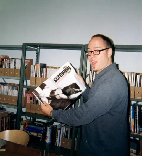 Man holding a magazine