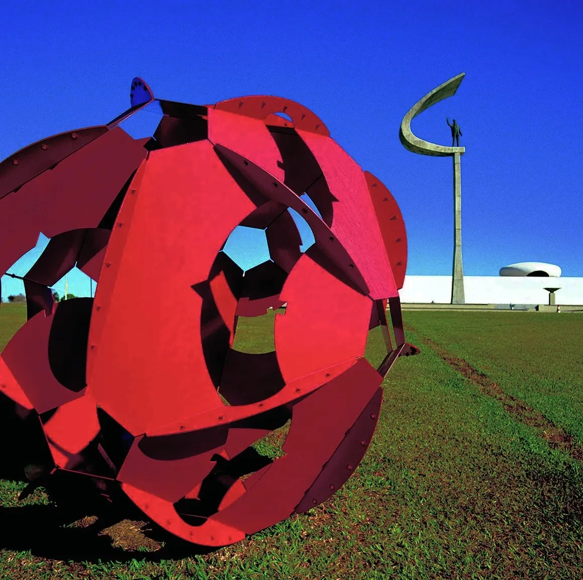Harrow Partners Red sculpture on grass picture by by Edmond Huot