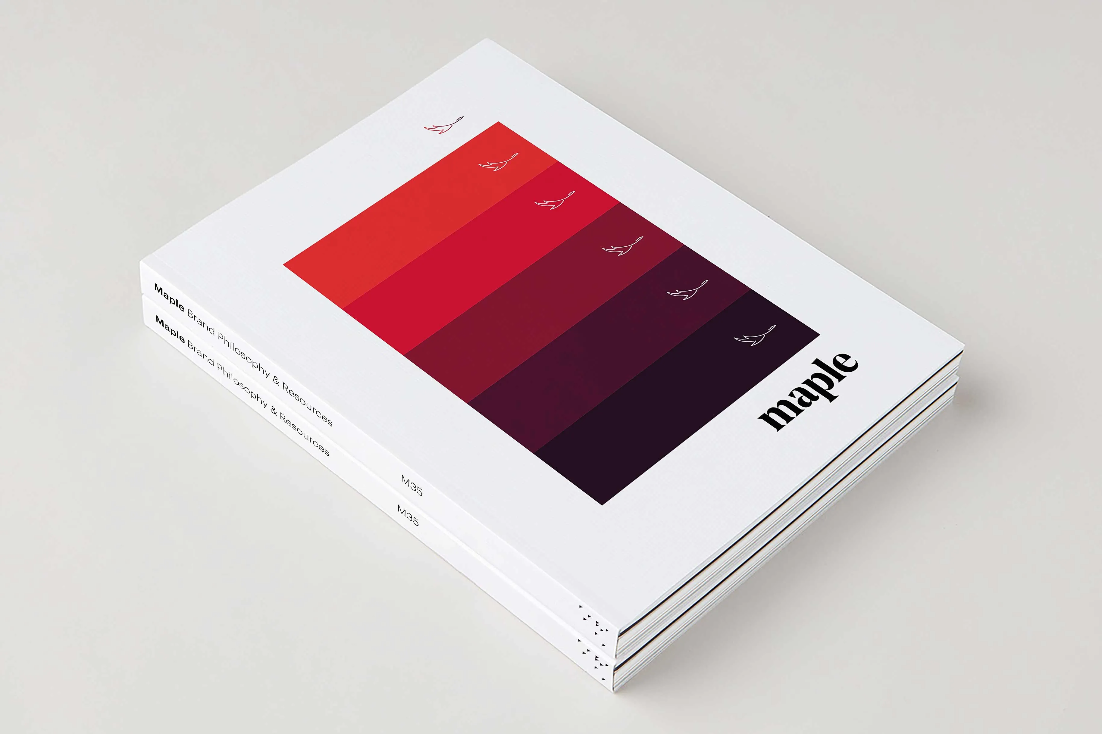 Maple product design stacked brand books stacked over design by Edmond Huot