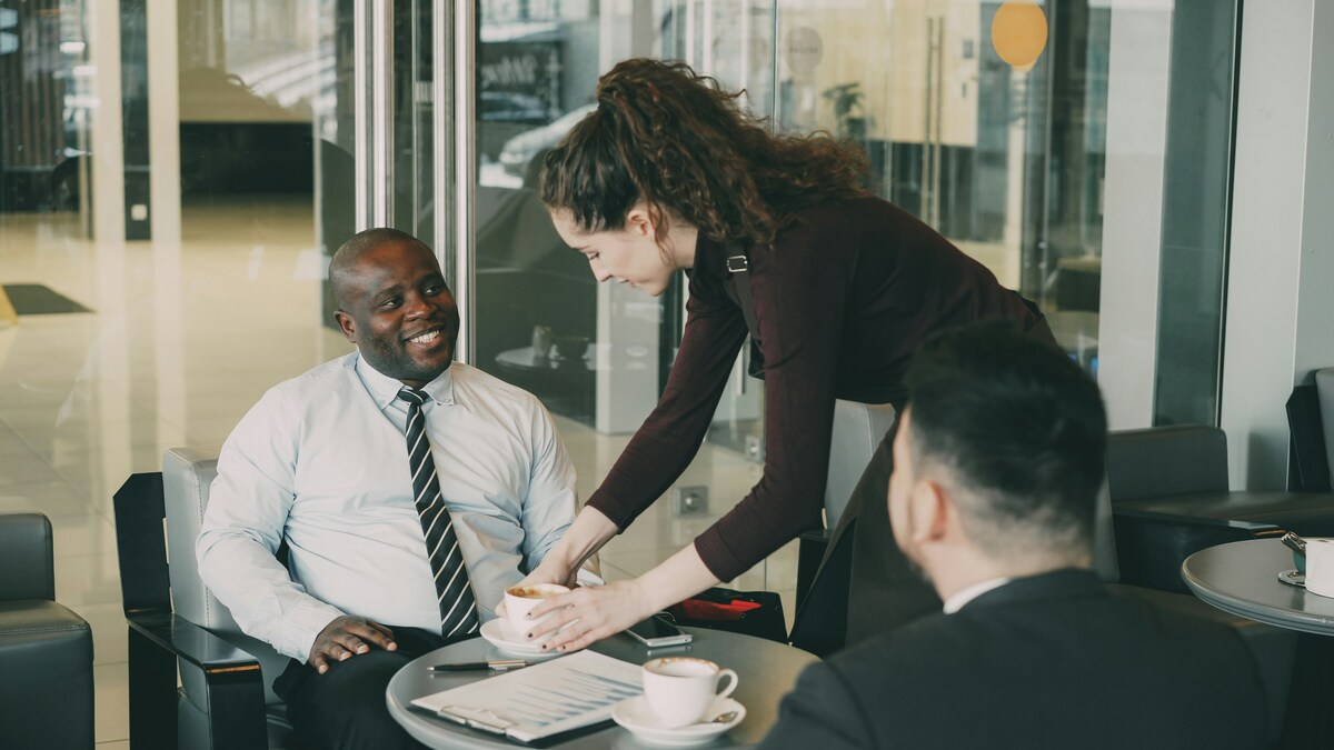 Employees collaborating in office for recruitment video content