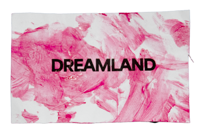 White rectangular fabric with pink watercolor brush strokes and the word DREAMLAND in black capital letters.