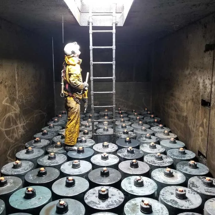 Expert stormwater vault maintenance near Bellevue, WA | Photo of a technician performning stormwater vault maintenance.