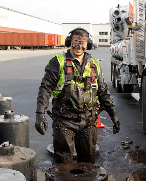 Expert stormwater vault maintenance near Bellevue, WA - Image of a stormwater expert during the cleaning  