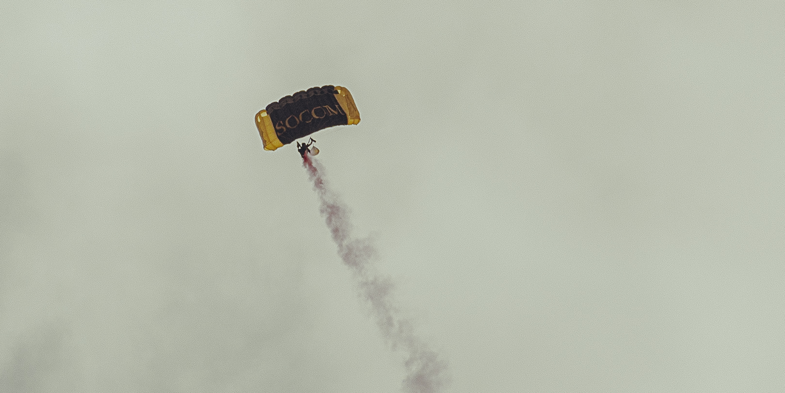 A sunset with fisherman in foreground