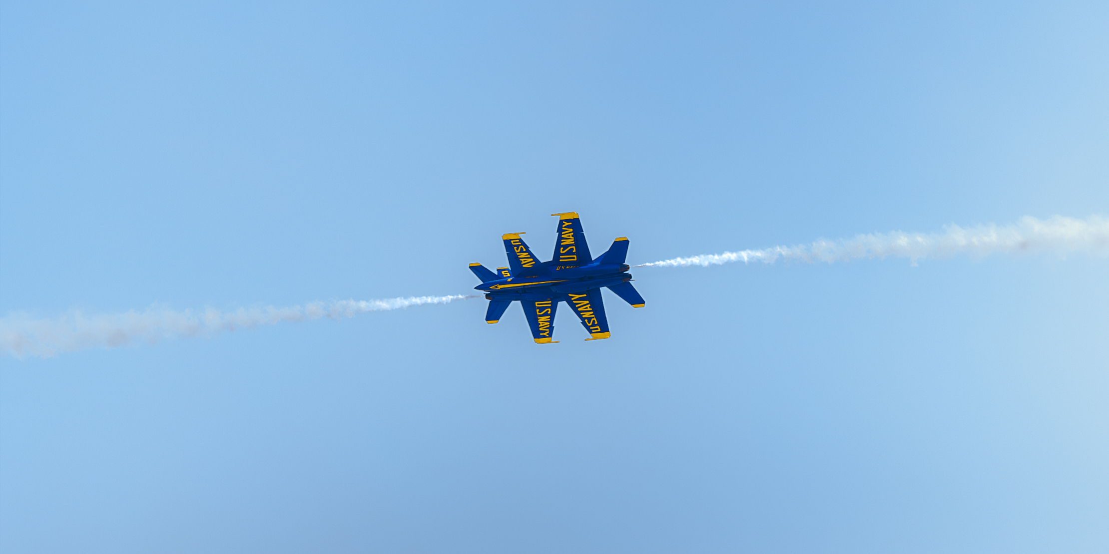 A sunset with fisherman in foreground