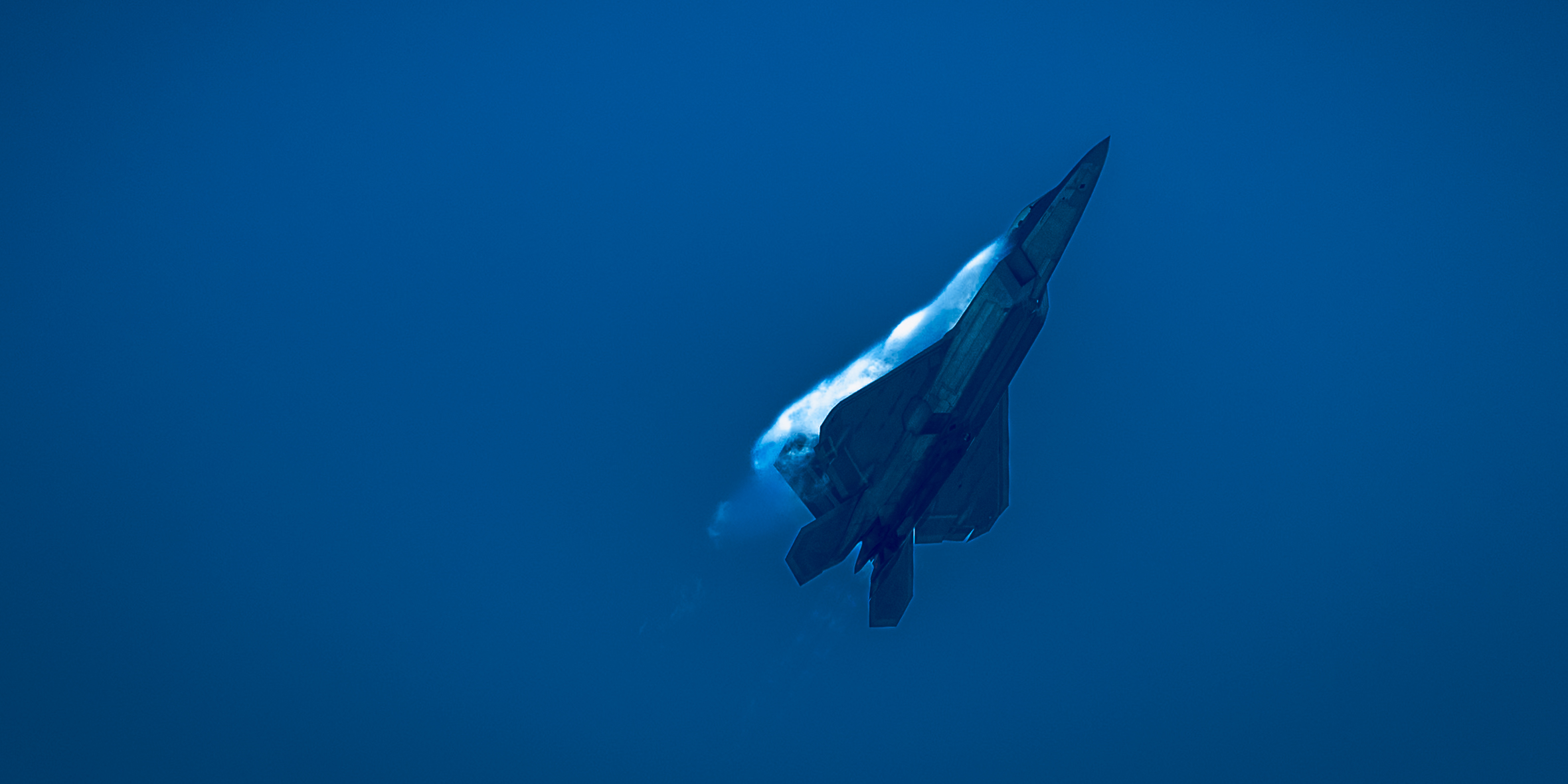 A sunset with fisherman in foreground