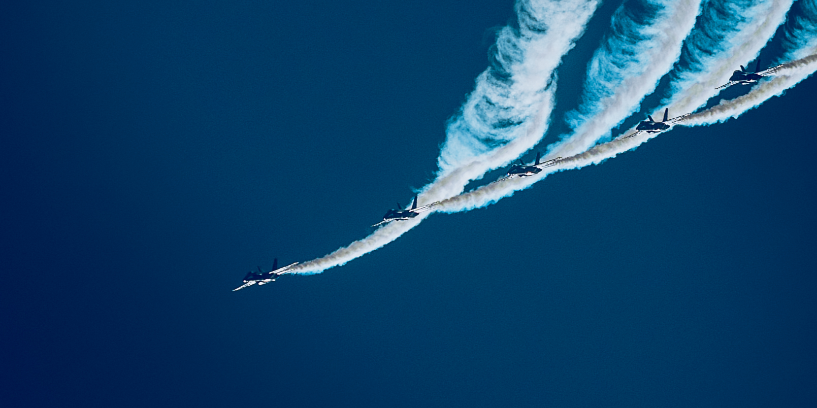 A sunset with fisherman in foreground