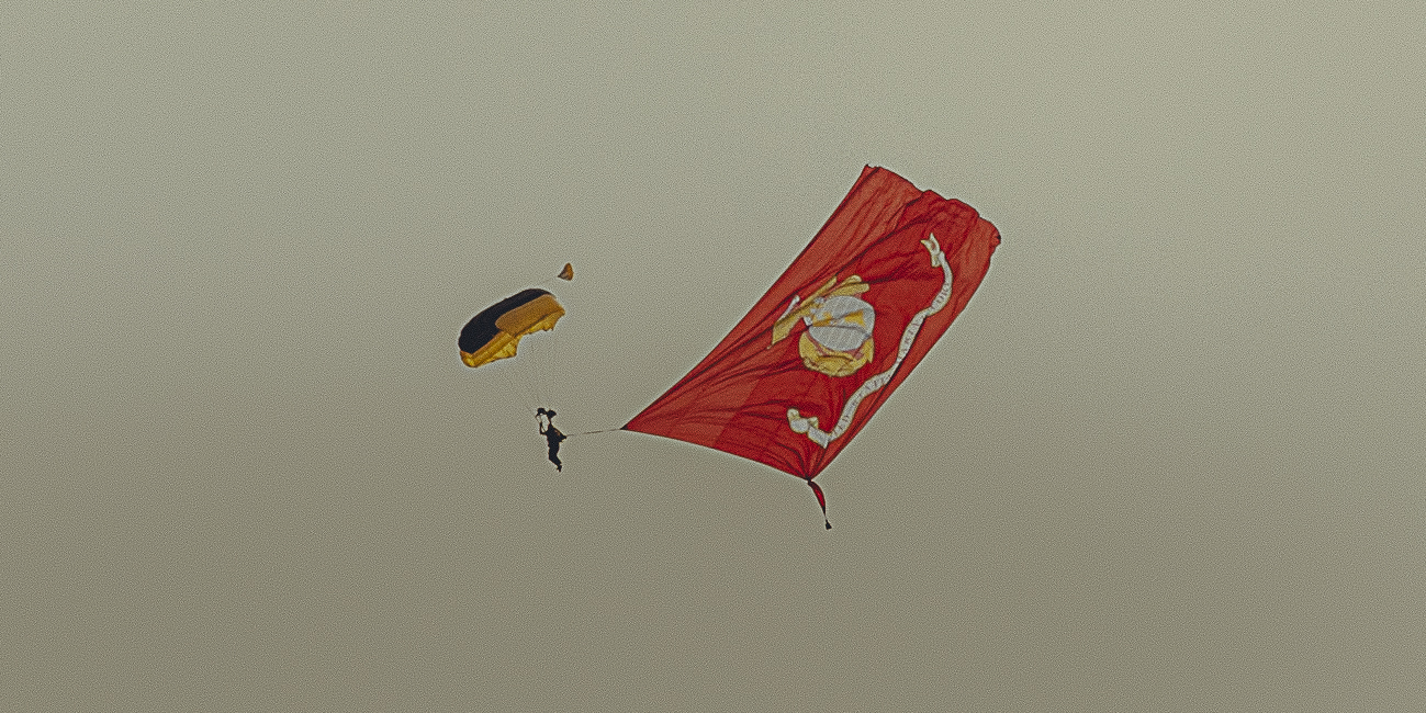 A sunset with fisherman in foreground