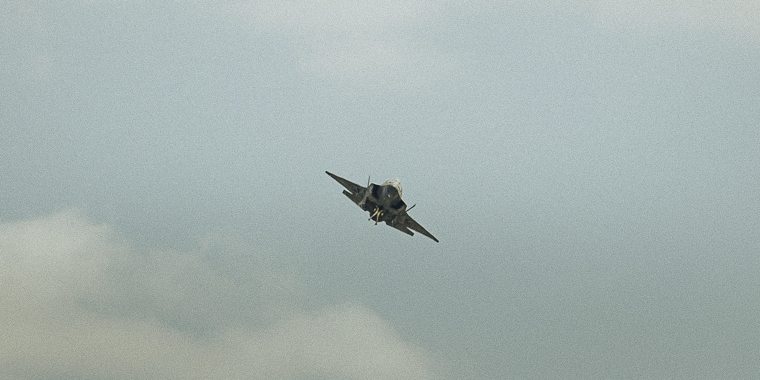 A sunset with fisherman in foreground