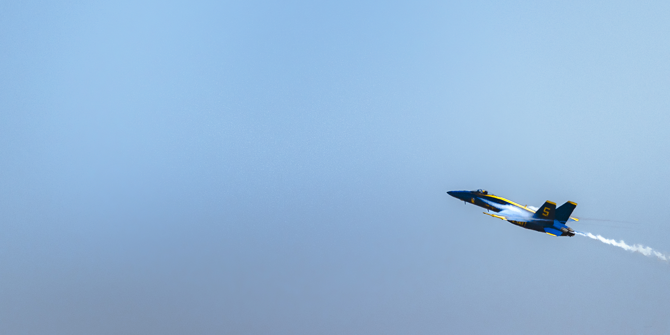 A sunset with fisherman in foreground