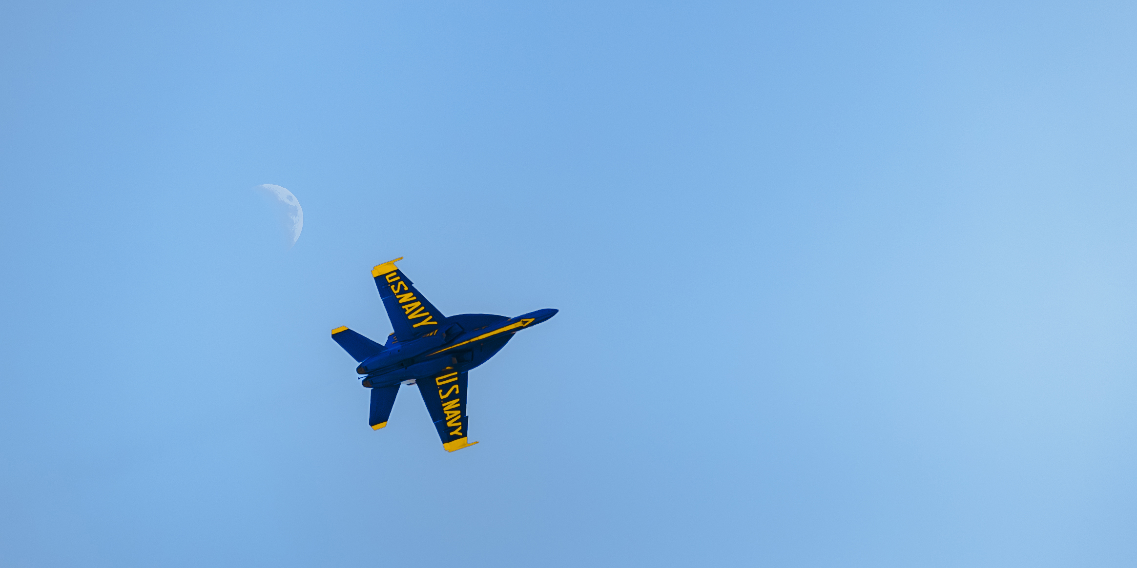 A sunset with fisherman in foreground