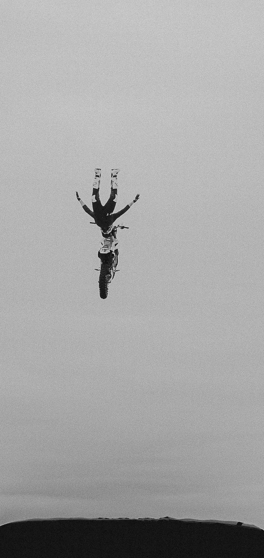 A sunset with fisherman in foreground