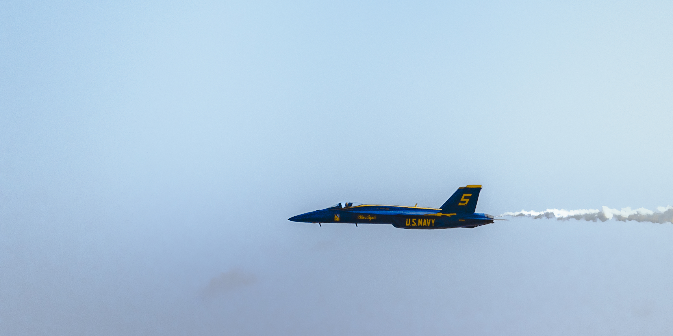 A sunset with fisherman in foreground