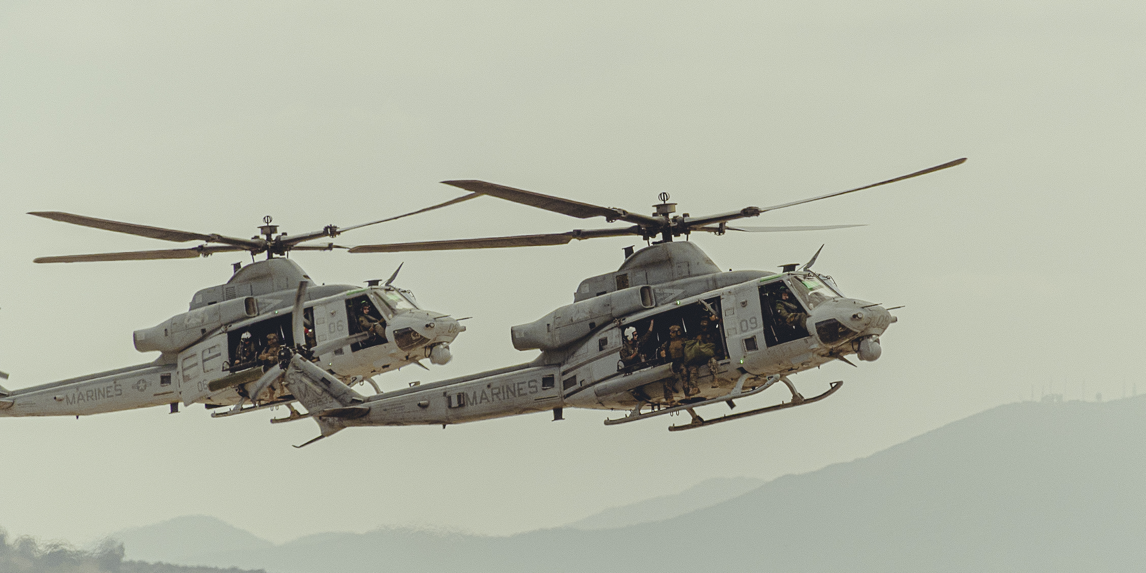 A sunset with fisherman in foreground