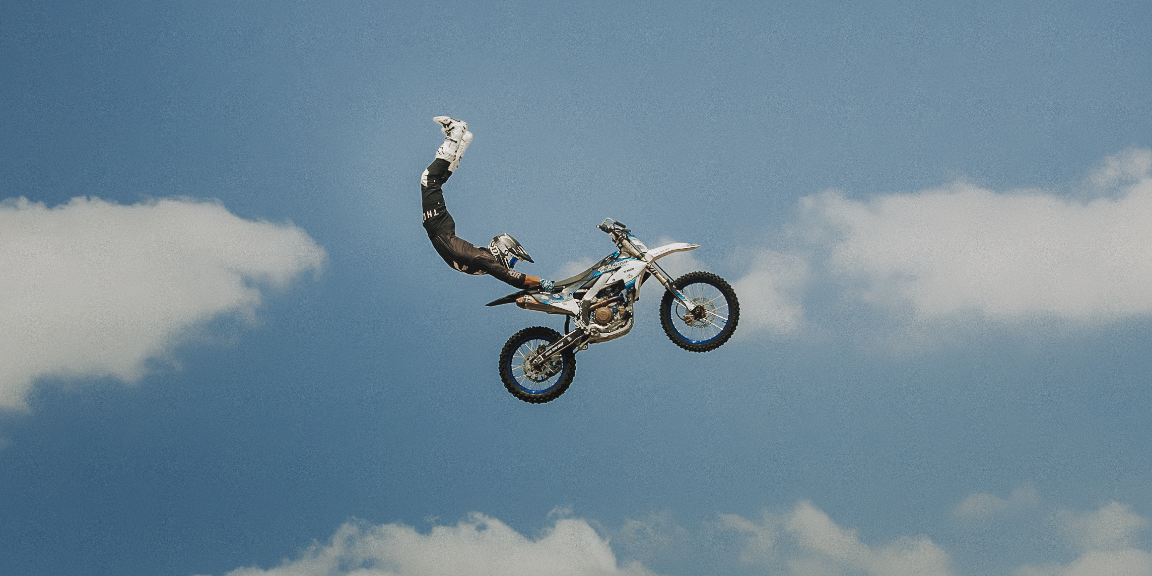 A sunset with fisherman in foreground