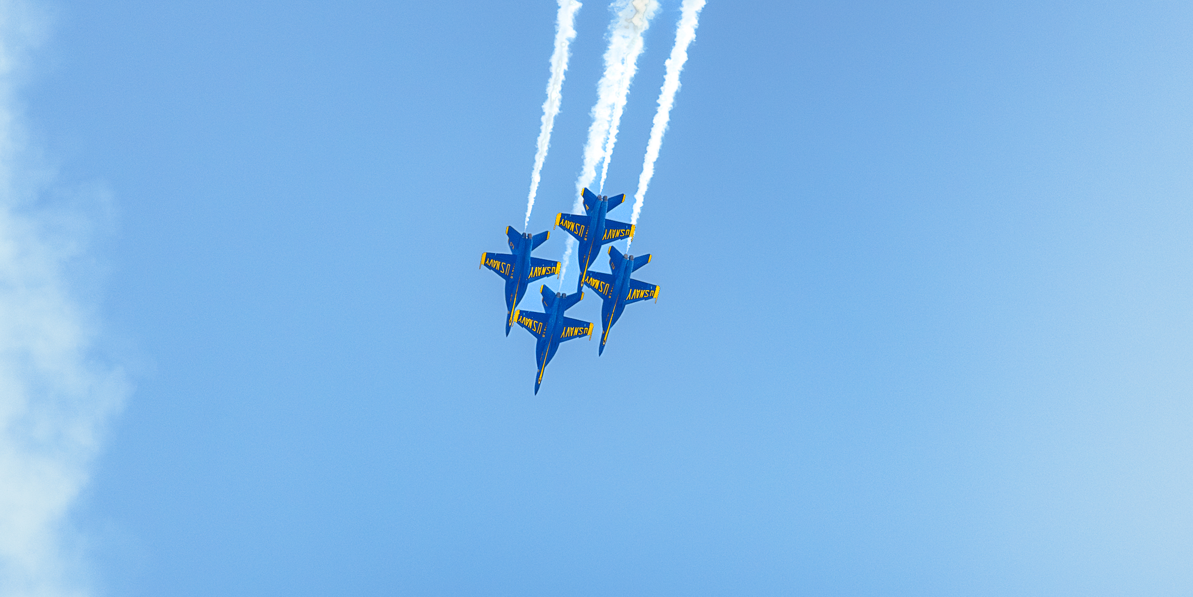 A sunset with fisherman in foreground