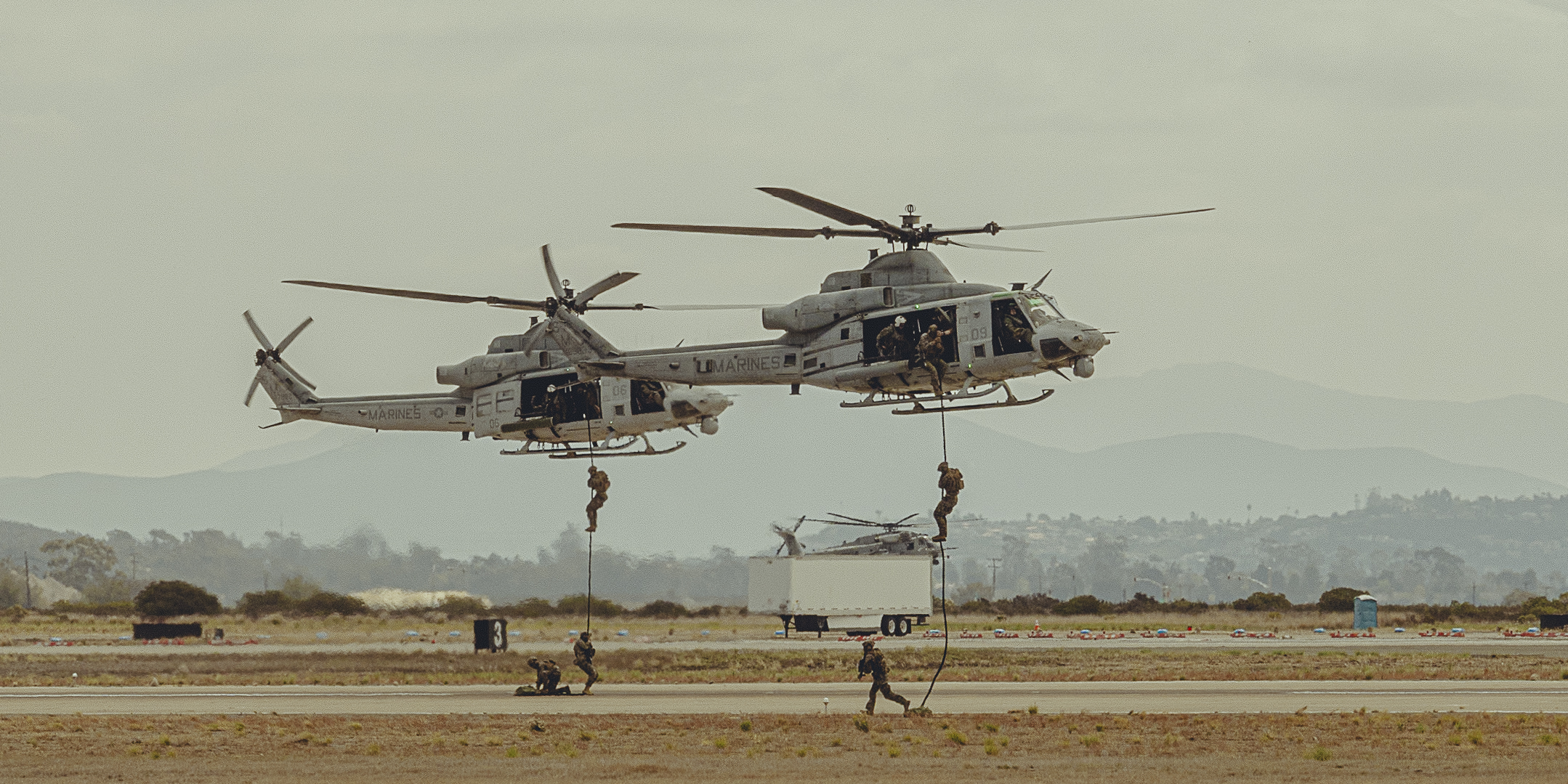 A sunset with fisherman in foreground
