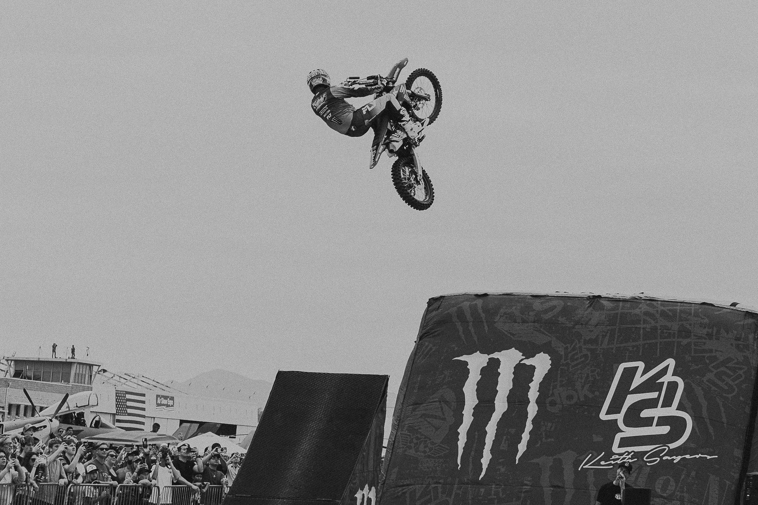 A sunset with fisherman in foreground