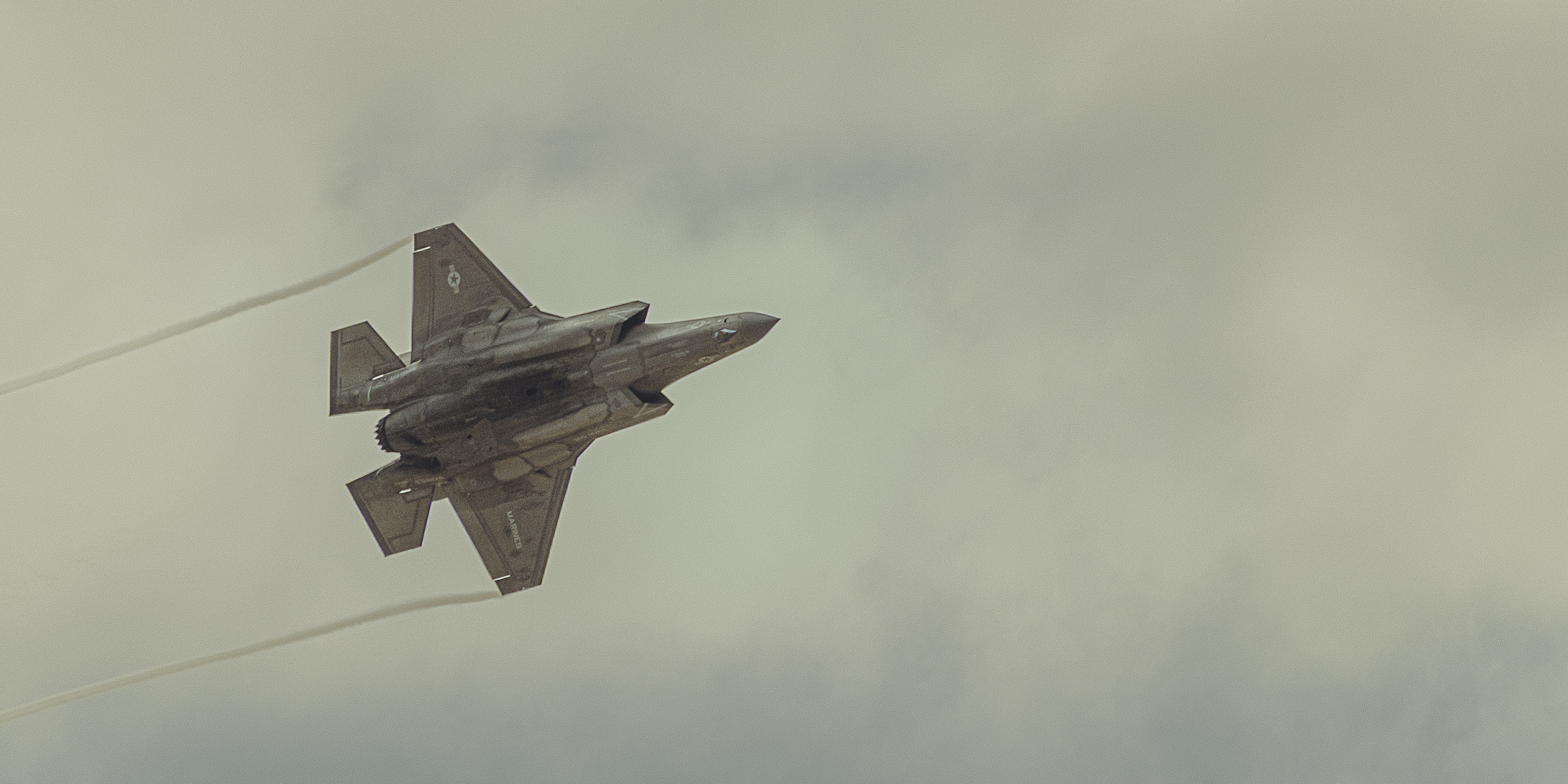 A sunset with fisherman in foreground
