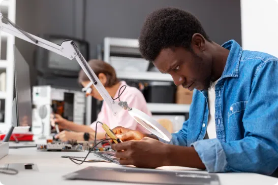 Students in classroom using laptops