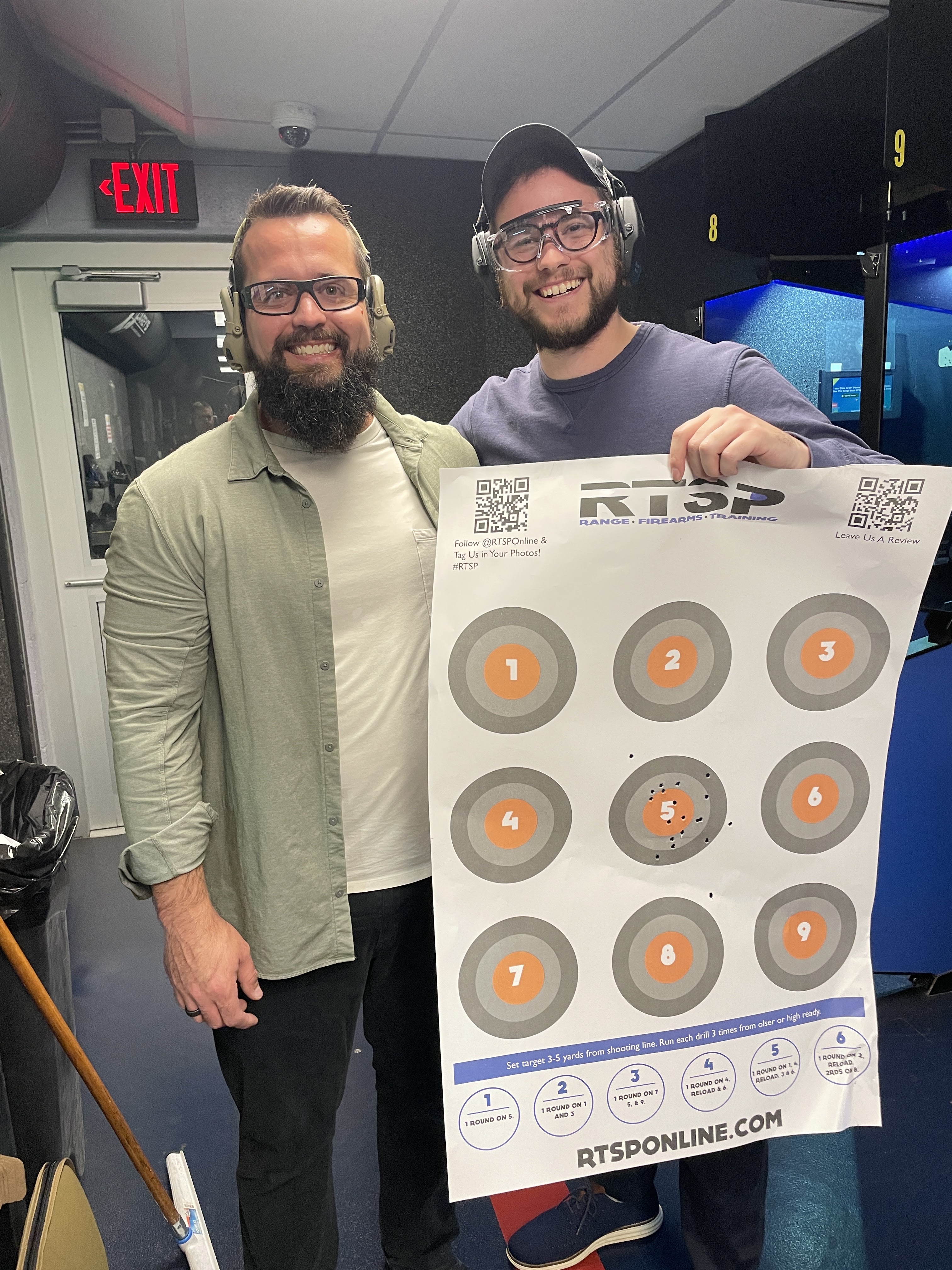 Two members of the community together at a shooting range