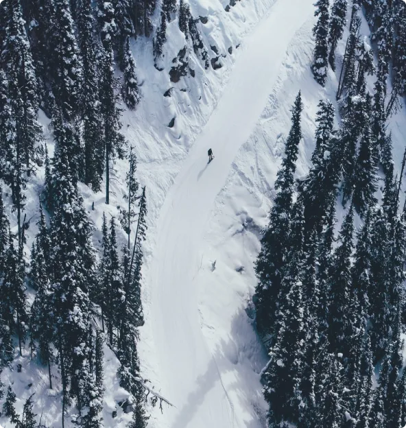 Person snowboarding down a ski hill