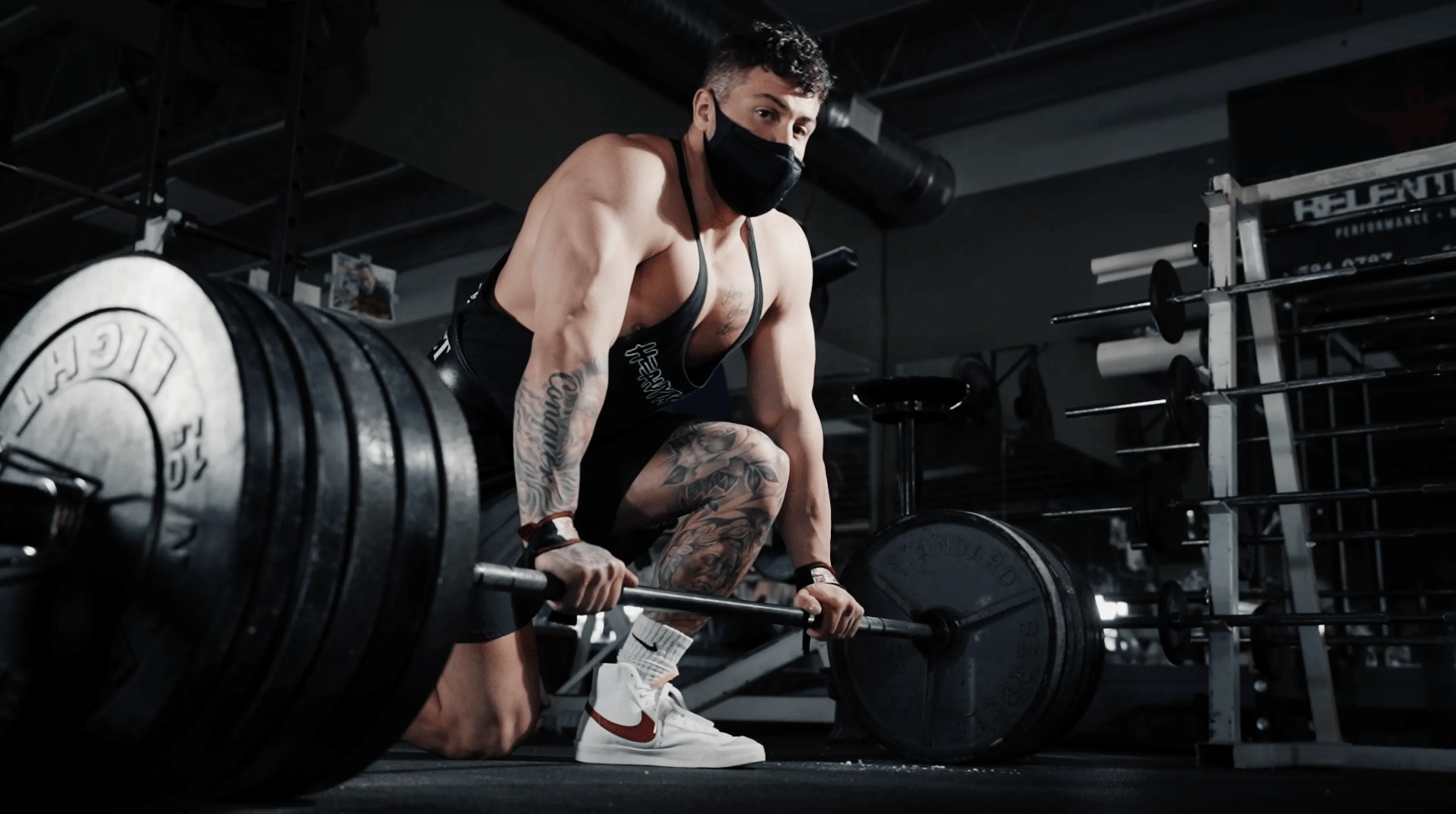 Man kneeling on a barbell